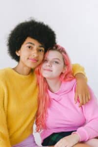 Who is Freya? People will embrace their individuality in the new Freya phase of history - photo of two young women in brightly coloured clothes.