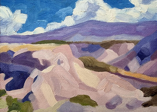 Original landscape oil painting - scene of desert valley with mountains and clouds in the background, colours are pinks and purples with some yellows.