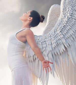 Spiritual awakening coaching - image of an angel stretching her wings.