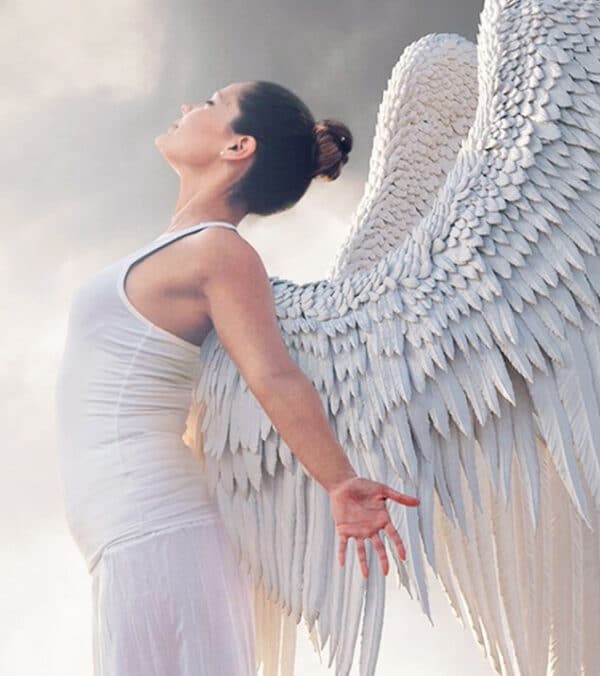 Spiritual awakening coaching - image of an angel stretching her wings.